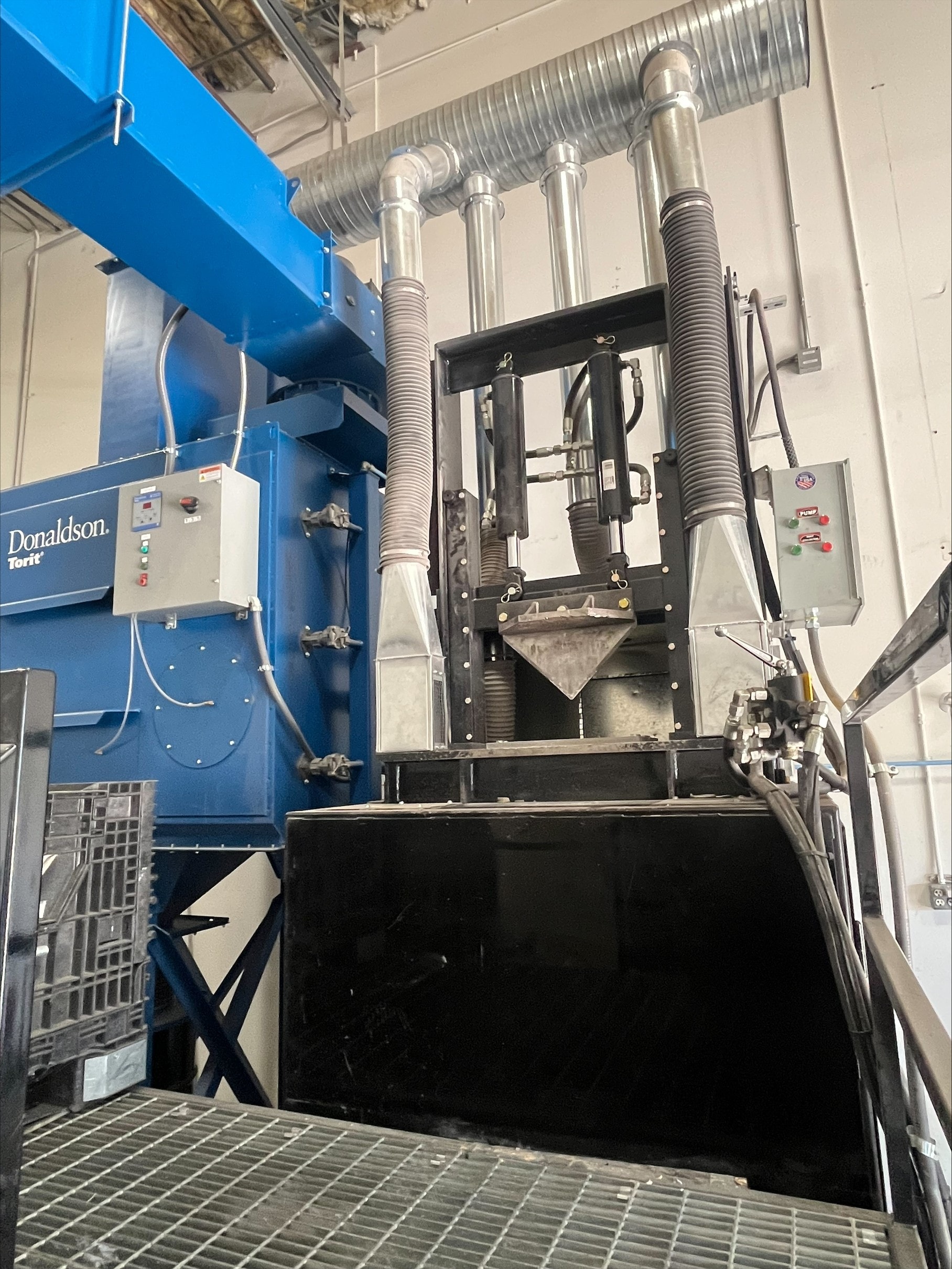 Industrial catalytic converter shearing equipment at Western Automotive Cores facility in North Las Vegas